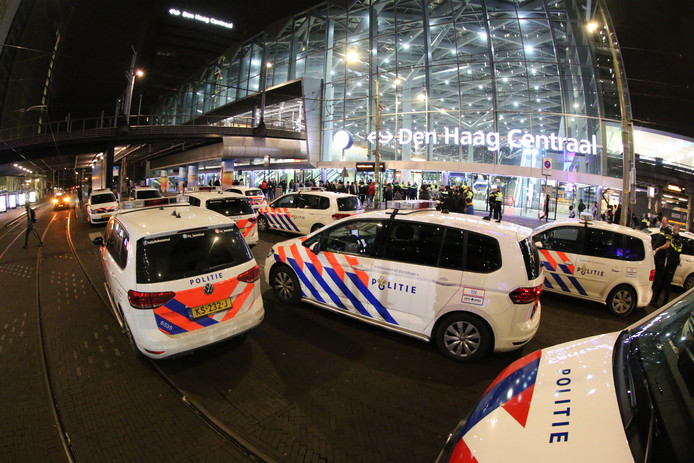 The police flocked out to keep people outside The Hague Central station.